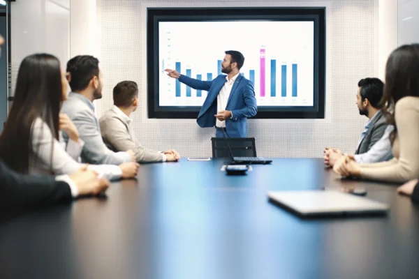 People at a business meeting reviewing results.