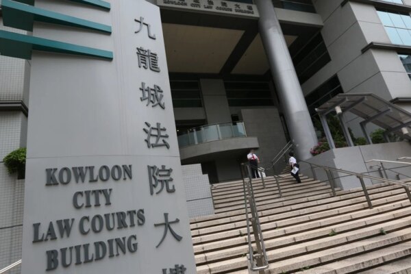 Hong Kong police charge man with manslaughter after reclassifying drug death