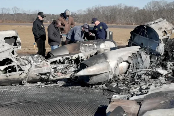 National Transportation Safety Board (NTSB) investigators view the wreckage of a Cessna 550 business jet after several people, including former NASCAR driver Greg Biffle, were killed in a crash during severe weather, at Statesville Regional Airport in Statesville, North Carolina, U.S. December 19, 2025 in a still image from a handout video.  NTSB/Handout via REUTERS.  THIS IMAGE HAS BEEN SUPPLIED BY A THIRD PARTY       TPX IMAGES OF THE DAY
