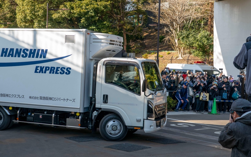 A truck believed to be carrying the twin pandas departs from Ueno Zoo in Tokyo on January 27, 2026, heading towards their return to China. The return came as ties between Japan and China quickly soured after Japan's Prime Minister Sanae Takaichi hinted that Tokyo could intervene militarily in the event of any attack on Taiwan. — AFP pic