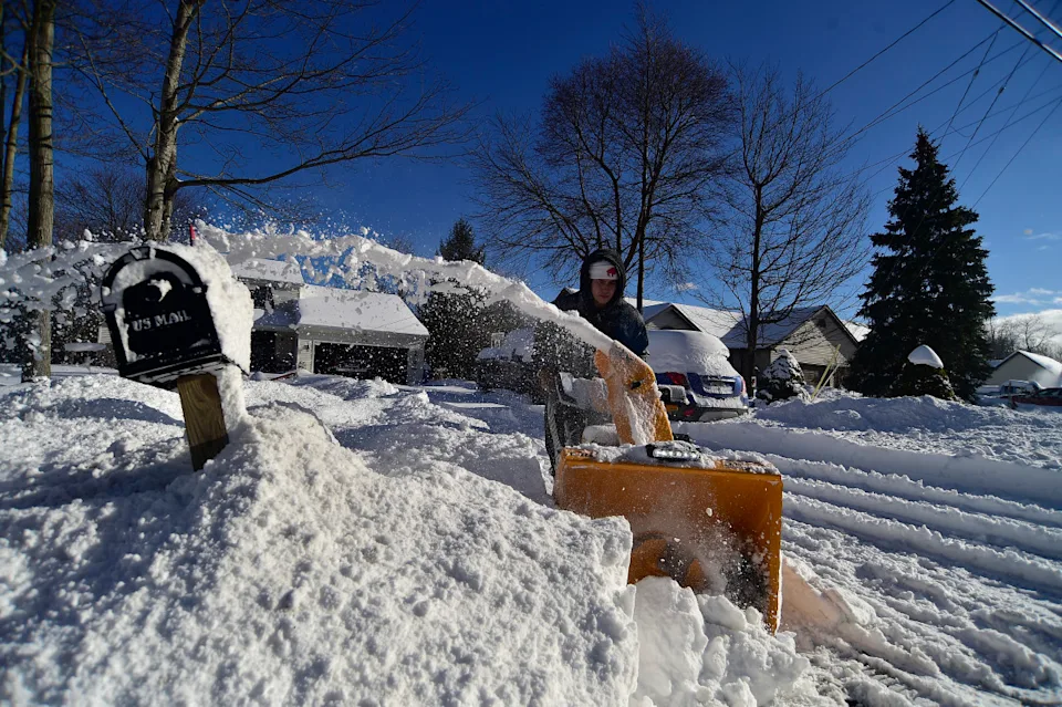 Drew Ahmed clears lake effect snow from his home January 1, 2026 in Lake View, New York. A massive cold front and strong winds traveling the entire length of Lake Erie combine to produce a rare phenomenon known as a seiche as well as dropping up to three feet of lake effect snow in Buffalo, New York and the surrounding suburbs. <p>&lpar;Photo by John Normile&sol;Getty Images&rpar;</p>