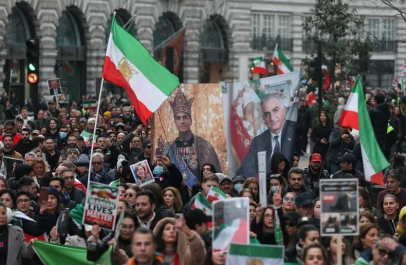 Protesters hold up images of Iran's last Shah Mohammad Reza Pahlavi and his exiled son and an Iranian opposition figure Reza Pahlavi, during the 'March for a Free Iran', held by Britain's Iranian Committee for Freedom and Stop The Hate, in London, Britain, January 18, 2026. (credit: REUTERS/TOBY MELVILLE)