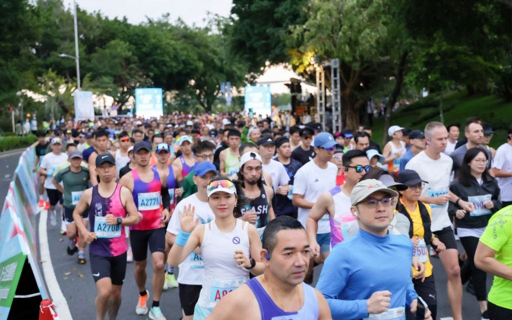 Participants run across Macao’s waterfront and bridges during the festive Macao International 10K race
