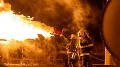 Firefighters work at the site of a drone and missile strike amid Russia's attack in Kyiv, Ukraine. (Photo: Sourced via Reuters)