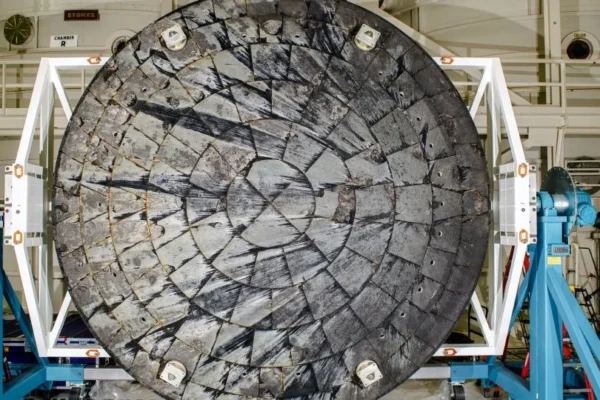 At the conclusion of the Artemis I test flight, the recovered Orion spacecraft was transported to Kennedy Space Center, where its heat shield was removed and inspected. - NASA