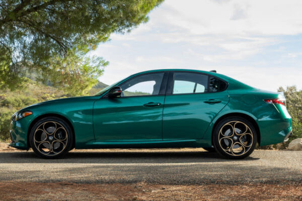 A 2025 Alfa Romeo Giulia Intensa parked under a tree