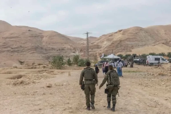 Israelis visit the Hasmonean Palaces in the city of Jericho, in the West Bank, accompanied by Israeli soldiers, during the Hanukkah holiday, December 21, 2025. (credit: CHAIM GOLDBERG/FLASH90)