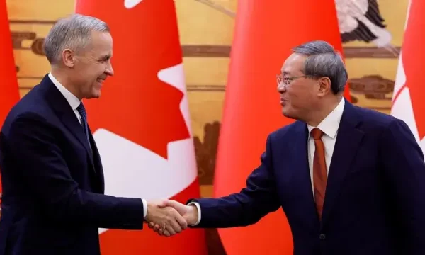 Carney shaking hands with a Chinese premier Li Qiang