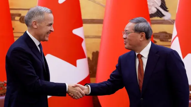 Carney shaking hands with a Chinese premier Li Qiang