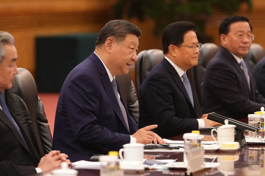 China's President Xi Jinping talks to Irish Prime Minister Micheal Martin during a bilateral meeting at the Great Hall of the People in Beijing, China, on Monday.