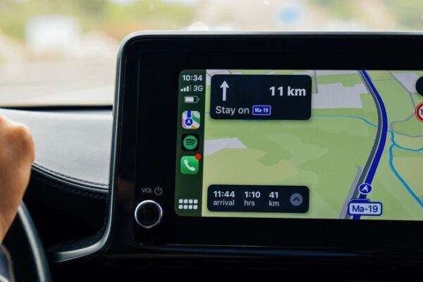 Driving a car using GPS navigation.