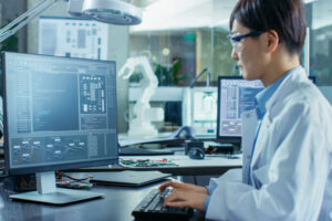 scientist researching at computer