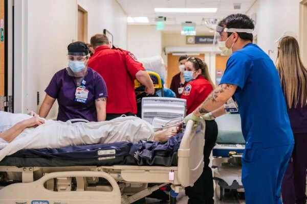Emergency room staff treat patients in a hospital hallway at Houston Methodist The Woodlands Hospital.