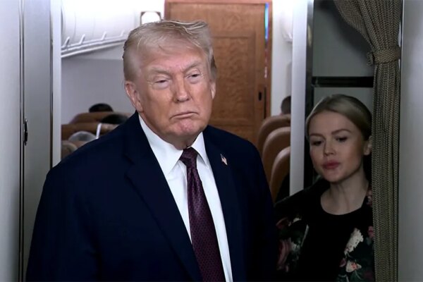 Trump speaks on Air Force One.