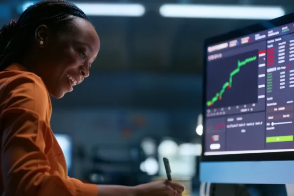 Investor watching a stock chart rise.