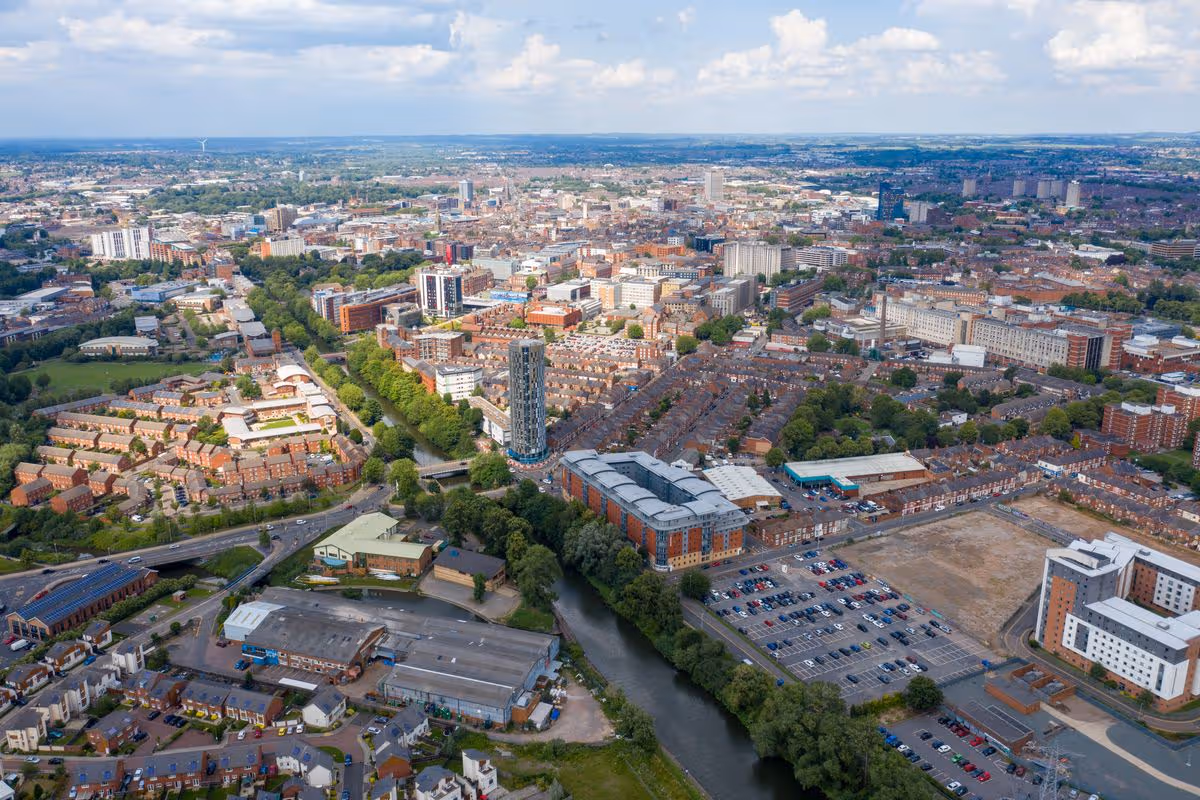 Aerial photo of the city centre of Leicester in the UK showing houses and apartment building on a sunny summers day