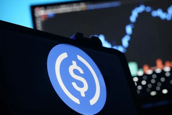 A stablecoin logo displayed on a smartphone. - McDonnell // Shutterstock