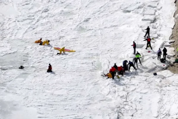 Search and rescue teams work to rescue two former West Hartford residents from the Bee's River Saturday. Kathleen "Kit" Boucher was removed from the ice-covered water, but died. Her husband, Gerard "Jerry" Boucher is believed to have died but has not been recovered, police say. (WCVB / Hearst TV)