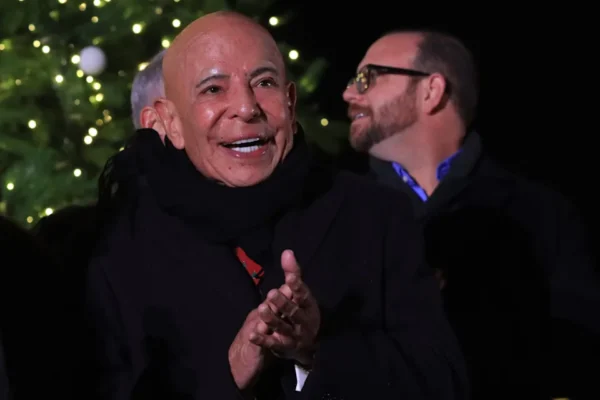 Fred Loya Sr. applauds during the opening ceremony and Christmas tree lighting sponsored by his company at the Holiday Lights Spectacular at Ascarate Park on Nov. 25, 2022.
