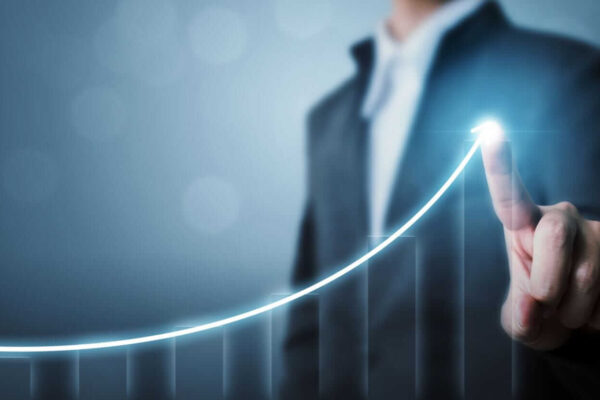 Businessman pointing arrow graph corporate future growth by Marchmeena29 via iStock