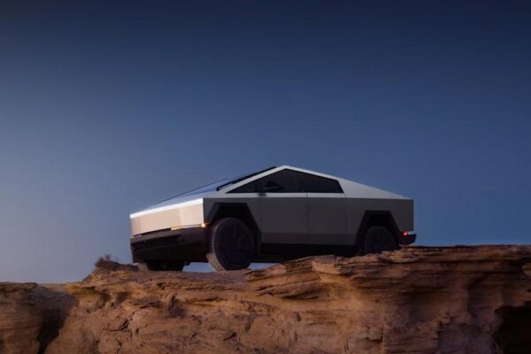 futuristic vehicle on a rocky cliff under a clear sky
