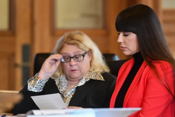 Brenda Tracy, right, and attorney Karen Truszkowski look over a revised agreement between Tracy and former MSU football coach Mel Tucker's legal team during her appearance in front of Judge Rosemarie Aquilina at the Ingham County Circuit Court in downtown Mason, Thursday, Oct. 26, 2023. Tucker did not appear.