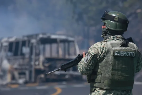 The killing of the powerful drug lord set off several hours of roadblocks with burning vehicles in Jalisco and other states.<span> Credit: AP</span>