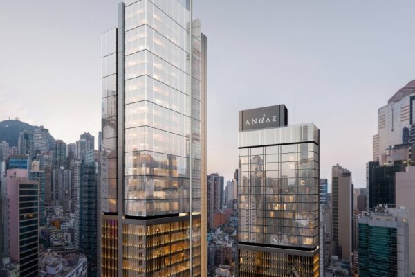 Skyscraper with glass facade and tall spire