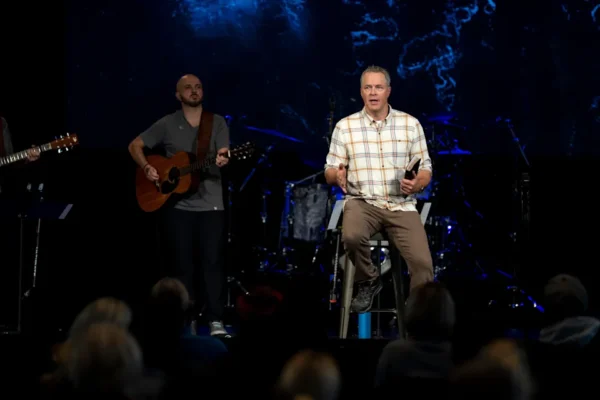 In this 2023 file photo, pastor Brian Tome leads a public prayer service for Buffalo Bills player Damar Hamlin at Crossroad Uptown Church in Cincinnati.