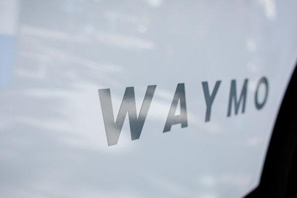 waymo logo on the side of a car