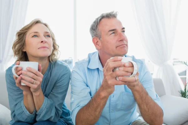 Two people holding mugs.