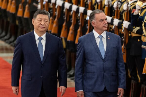 Uruguayan President Yamandu Orsi walks with Chinese President Xi Jinping during a welcome ceremony at the Great Hall of the People in Beijing, China, February 3, 2026.