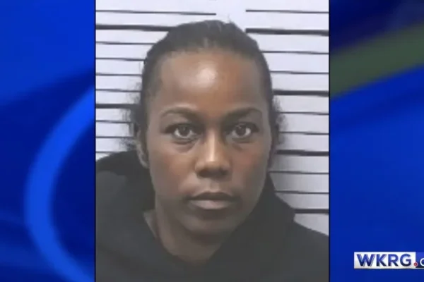 Shawanda Smith mugshot, placed on a blue background with the WKRG.com logo