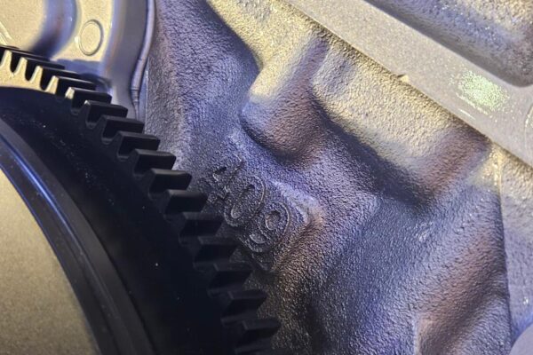 closeup of a ls6 v8 with a visible numerical engraving of 409