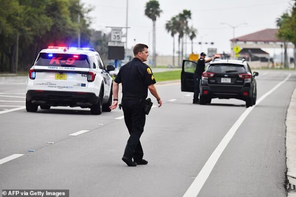 Police officers with the Tampa Police Department block traffic along South Dale Mabry Highway near the main entrance of MacDill Air Force Base, which houses CENTCOM headquarters, after a suspicious package was reported at the gate in Tampa, Florida, on March 16