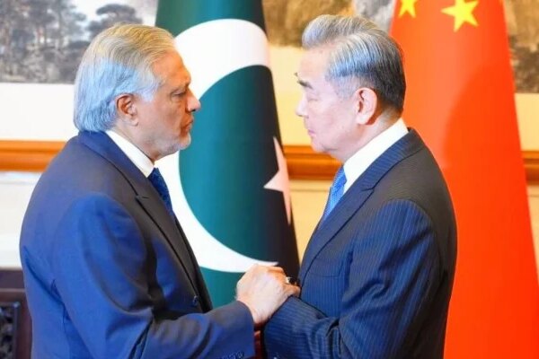 China’s Foreign Minister Wang Yi (right) receives Deputy Prime Minister and Foreign Minister Ishaq Dar upon arrival at the Diaoyutai State Guest House in Beijing, China, March 31, 2026. — X/@ForeignOfficePk