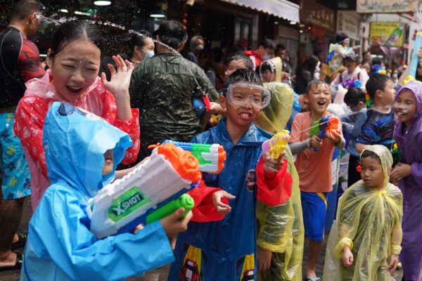 People splash water during Songkran at Kowloon City. Photo: Sam Tsang