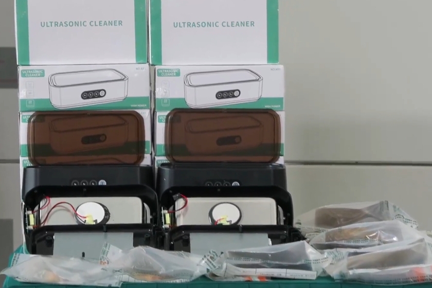 Some of the multi-purpose cleaning machines and ultraviolet cleaning machines used to conceal the batch of suspected precious metals in the case, as well as some of the seized suspected precious metals. Photo: Hong Kong Customs