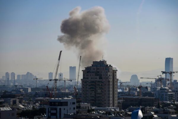 Smoke billows from a building in Tel Aviv following an Iranian missile strike on Tuesday. Photo: AP