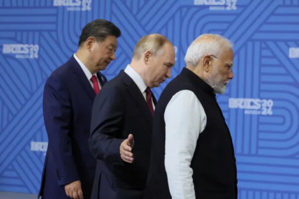 Chinese President Xi Jinping, Russian President Vladimir Putin and Indian Prime Minister Narendra Modi enter a hall for the family photo before a plenary session of the BRICS 2024 Summit in Kazan, Russia, 23 October 2024. MAXIM SHIPENKOV/Pool via REUTERS REFILE - QUALITY REPEAT TPX IMAGES OF THE DAY