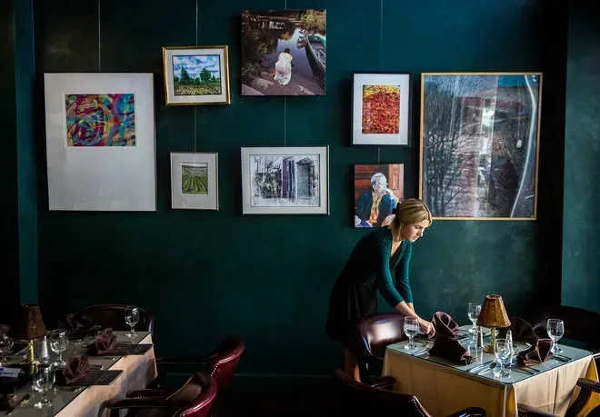 Staff at Vera Mae's Bistro prepares the restaurant for its dinner opening in 2021.