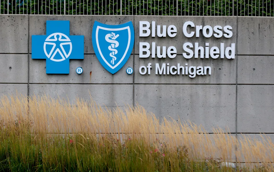 The Blue Cross Blue Shield of Michigan sign and logo in front of their two office towers at the Renaissance Center in downtown Detroit on Wednesday, Sept. 13, 2023.
