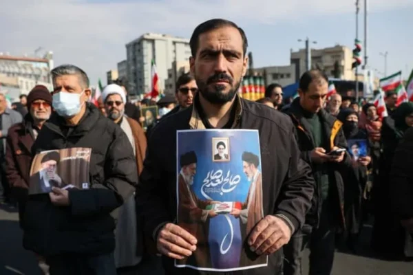 A man holds a placard with an image of Iran's new supreme leader Mojtaba Khamenei with late Iranian Supreme Leader Ayatollah Ali Khamenei, during a gathering to support Mojtaba Khamenei, amid the U.S.-Israeli conflict with Iran, in Tehran, Iran, March 9, 2026. (credit: MAJID ASGARIPOUR/WANA (WEST ASIA NEWS AGENCY) VIA REUTERS)