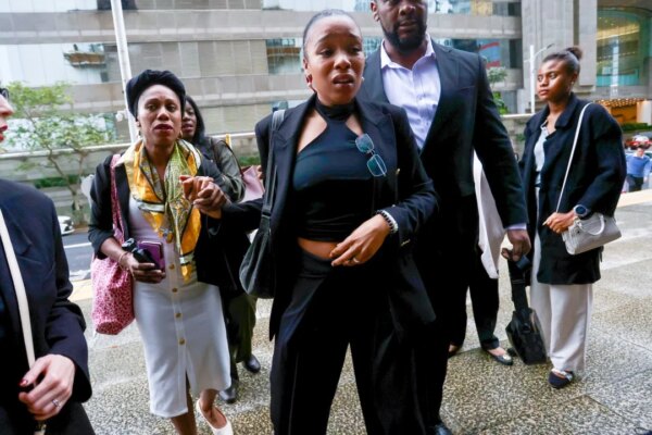 Hong Kong court convicts British woman of blackmailing banker over false rape claim