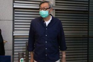 Fung Wai-kong leaves the force’s headquarters in Wan Chai in June 2021. Photo: Handout