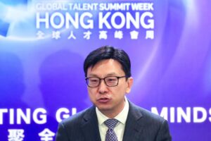 Secretary for Labour and Welfare Chris Sun speaks to the media at the Global Talent Summit Week. Photo: Karma Lo