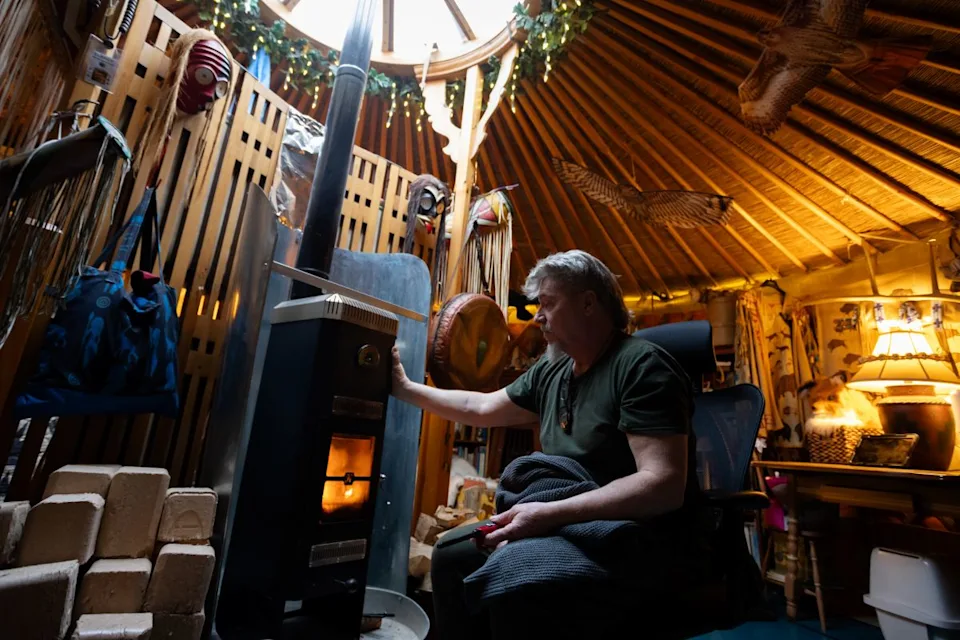 Paul Ridlon sits in his yurt.