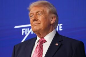 US President Donald Trump takes the stage at the Future Investment Initiative Institute's summit. (AP)