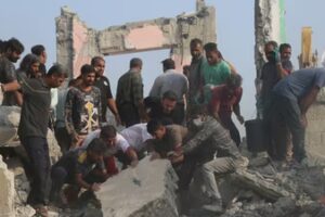 Rescue workers and residents search through the rubble in the aftermath of what Iranian officials said was an Israeli-U.S. strike on a girls' elementary school in Minab, Iran. (AP)