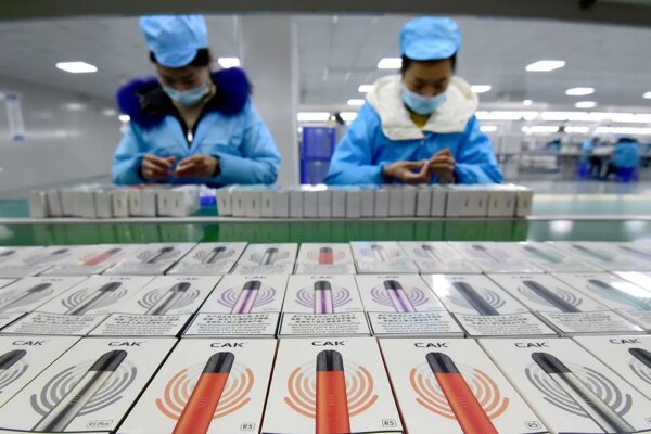 Workers package e-cigarettes.